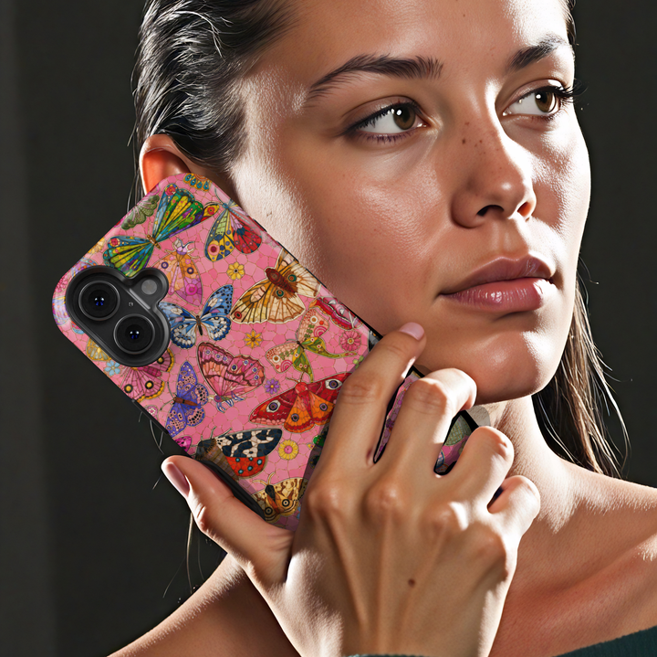 Pink butterfly iPhone case featuring colorful butterflies, moths, flowers, and whimsical nature-inspired artwork.