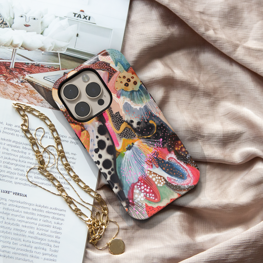Colorful abstract iPhone case featuring playful squiggles, organic shapes, modern artistic patterns, and vibrant contemporary artwork.