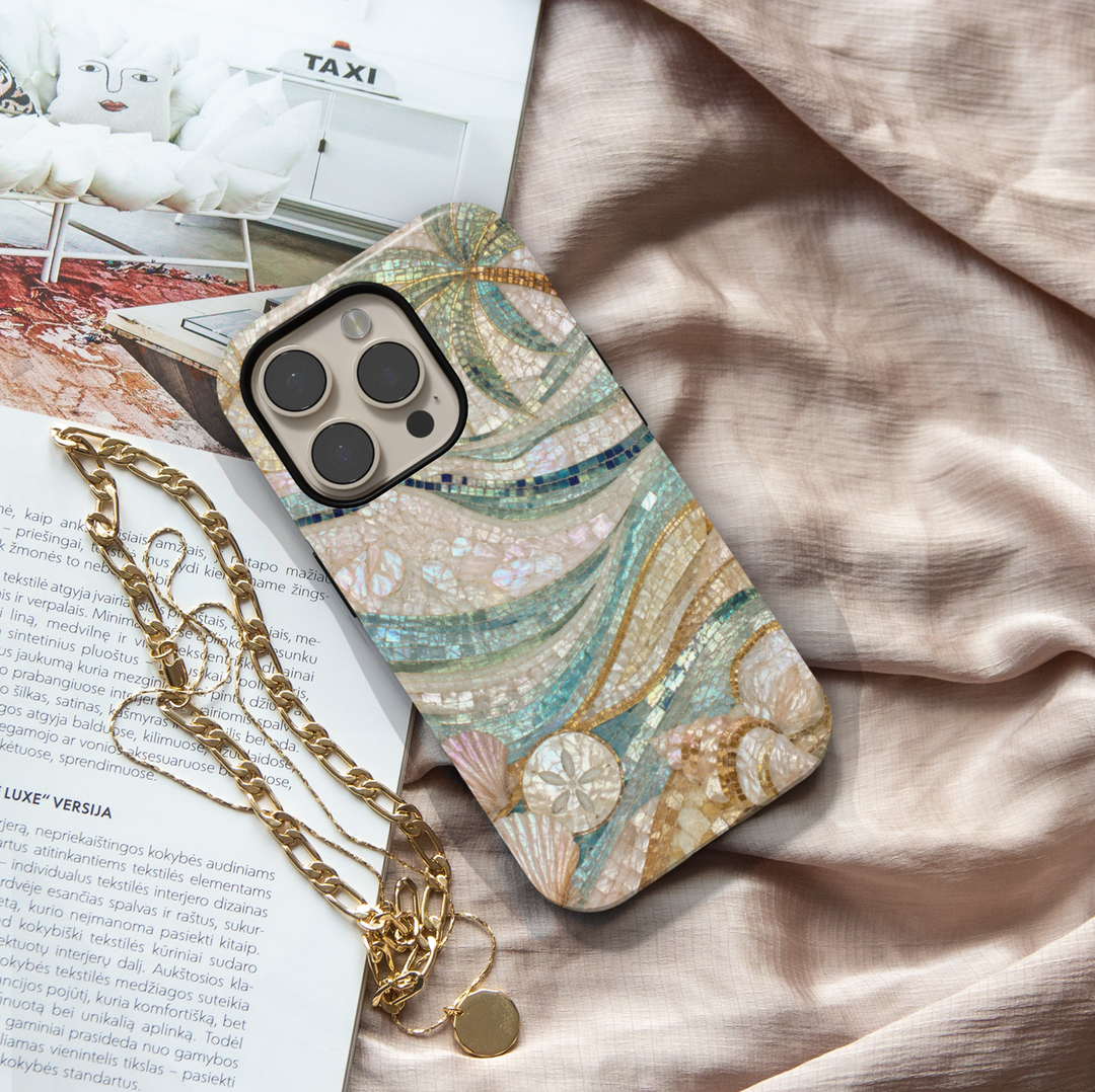 Elegant iPhone case featuring mosaic ocean waves, seashells, sand dollars, pearl details, and luxurious coastal artwork.