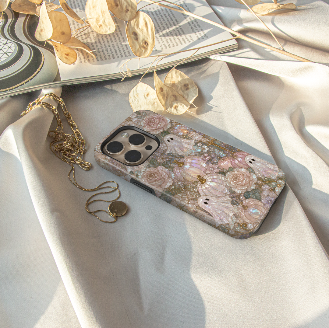 Elegant iPhone case featuring cute pearl ghosts, blush pumpkins, ivory roses, butterflies, candles, and luxurious coquette Halloween artwork.