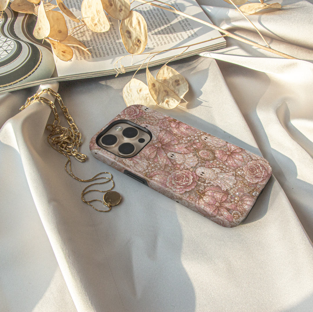 Blush Ghost Coquette iPhone case with pearl ghosts, pink satin bows, pearl pumpkins, roses, vintage cameo, lace, and elegant Halloween aesthetic.