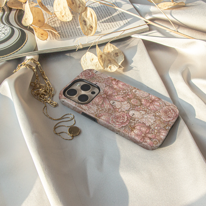 Blush Ghost Coquette iPhone case with pearl ghosts, pink satin bows, pearl pumpkins, roses, vintage cameo, lace, and elegant Halloween aesthetic.