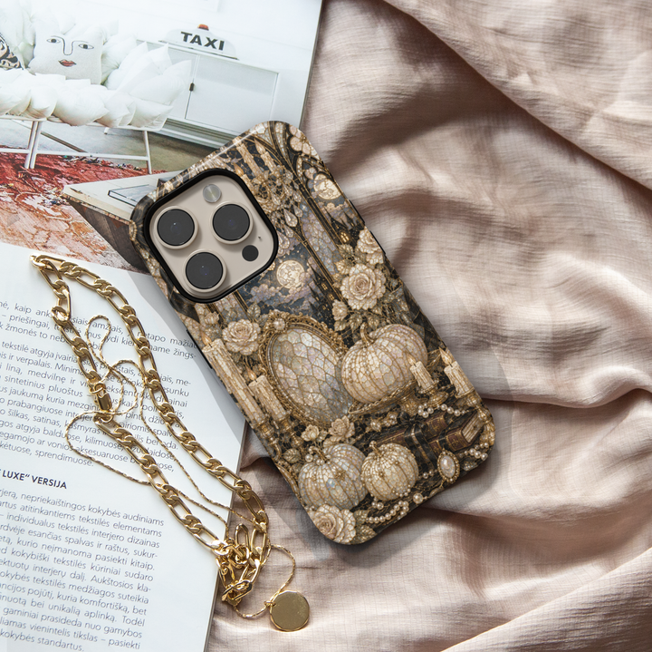 Elegant Halloween iPhone case featuring pearl pumpkins, ivory roses, candles, vintage books, ornate mirror, and a moonlit gothic castle.