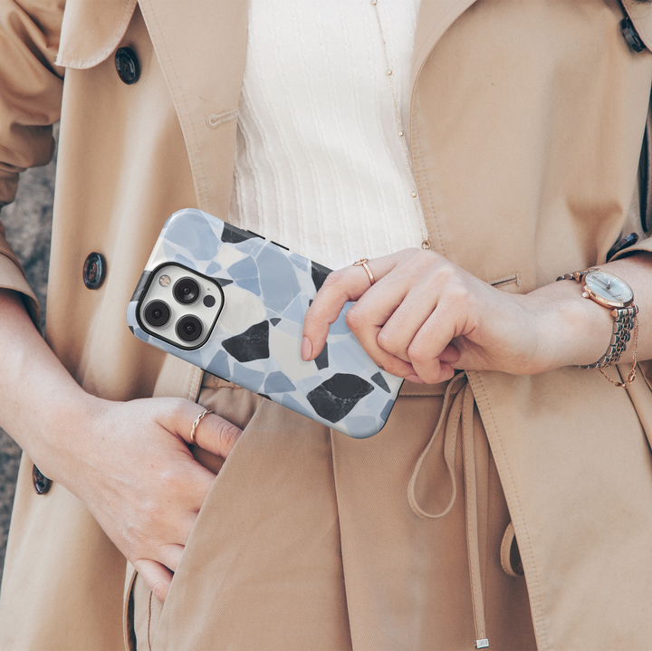 Cold Stone blue terrazzo iPhone 18 Pro Max MagSafe case featuring icy powder blue, ivory and charcoal marble stone shapes, a modern luxury protective tough iPhone 18 Pro phone case with an abstract terrazzo design and MagSafe compatibility.