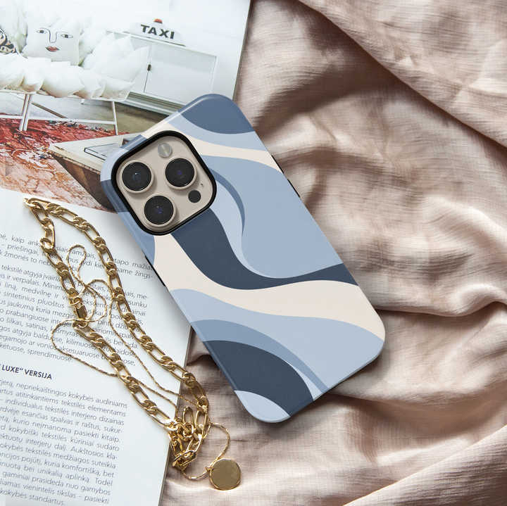 Blue Hour abstract iPhone 18 Pro Max MagSafe case featuring flowing powder blue, navy blue and ivory cream waves, a modern minimalist protective tough iPhone 18 Pro phone case with an aesthetic abstract design and MagSafe compatibility.