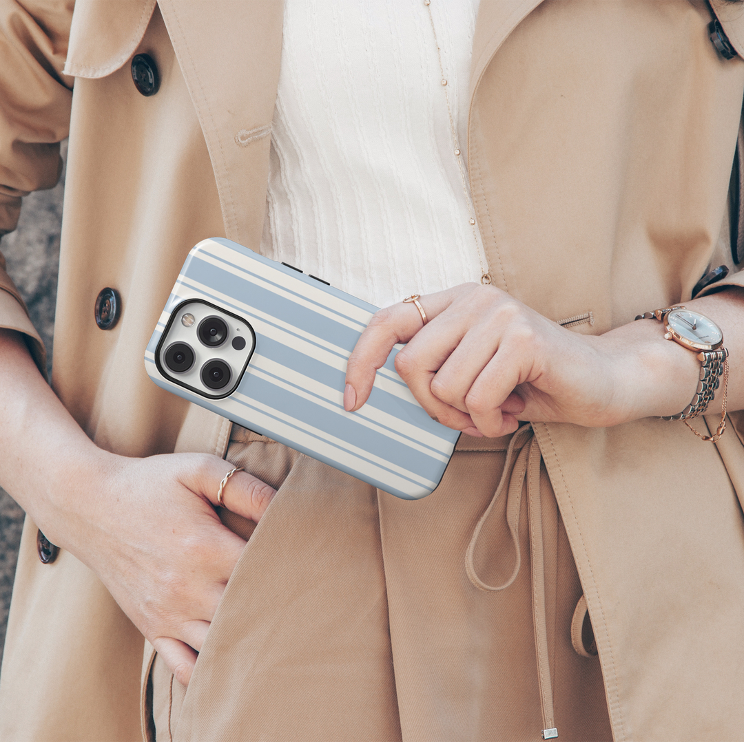Sunday Service blue striped iPhone 18 Pro Max MagSafe case with powder blue and warm ivory vertical stripes, a preppy minimalist protective tough iPhone 18 Pro phone case with a classic cream and blue striped design and MagSafe compatibility.