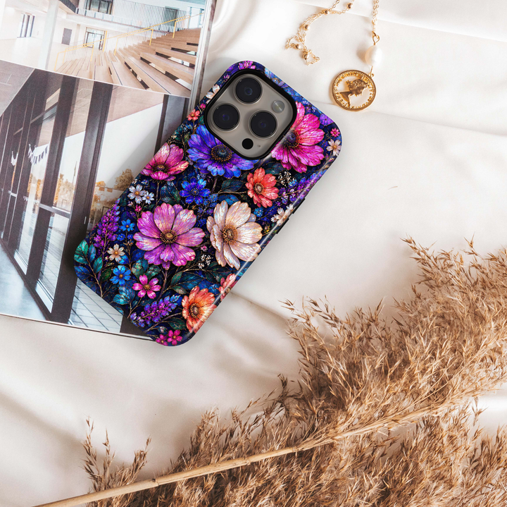 Midnight Wildflower iPhone 18 Pro Max MagSafe case featuring jewel-toned pink, purple, blue, coral and ivory flowers with deep teal foliage on a dark midnight background, a luxurious stained-glass-inspired tough iPhone 18 Pro floral phone case with MagSafe compatibility.