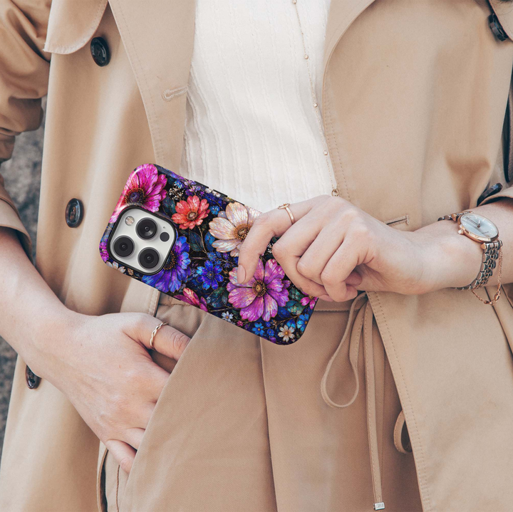 Midnight Wildflower iPhone 18 Pro Max MagSafe case featuring jewel-toned pink, purple, blue, coral and ivory flowers with deep teal foliage on a dark midnight background, a luxurious stained-glass-inspired tough iPhone 18 Pro floral phone case with MagSafe compatibility.