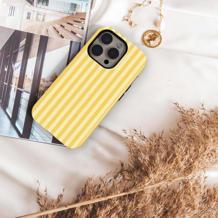Lemon Chiffon iPhone 18 Pro Max MagSafe case featuring vertical butter yellow, lemon and creamy pastel stripes, a preppy minimalist tough iPhone 18 Pro phone case with soft yellow aesthetic and MagSafe compatibility.