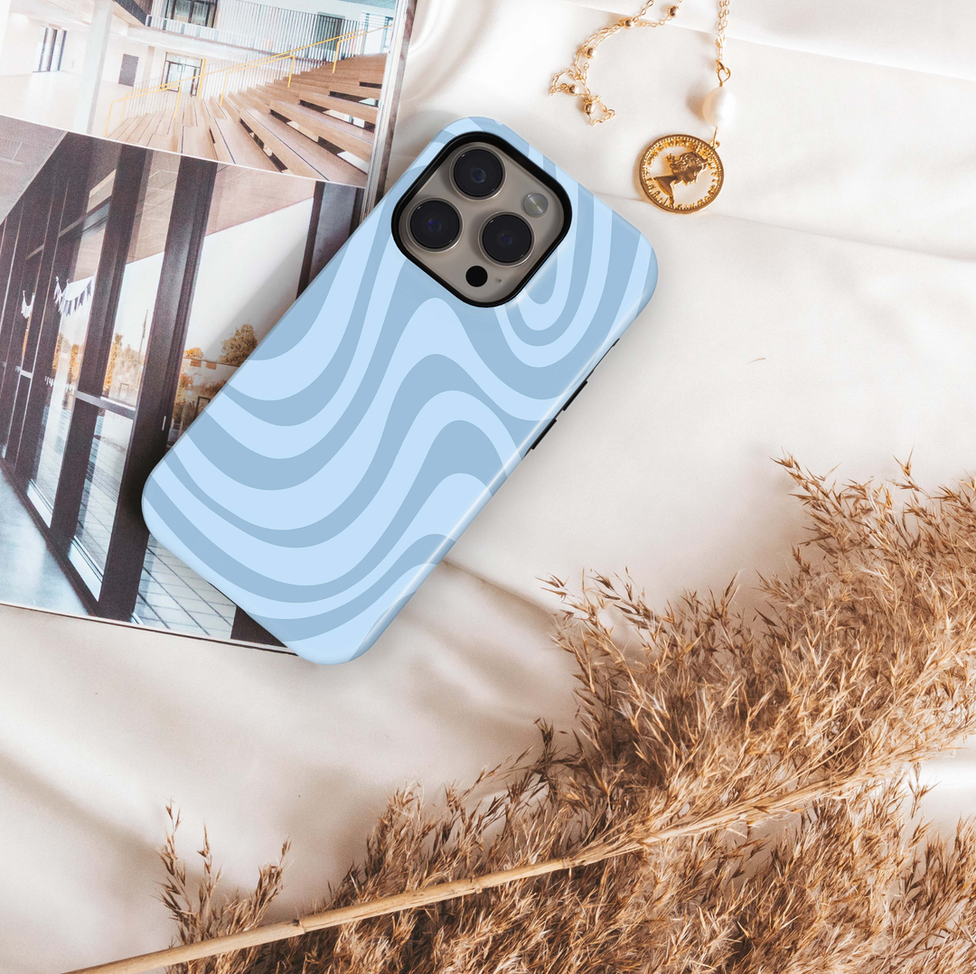 Blue Current light blue iPhone 18 Pro Max MagSafe case with oversized flowing curved waves in tonal powder blue shades, a minimalist abstract tough iPhone 18 Pro phone case with modern retro aesthetic and MagSafe compatibility.