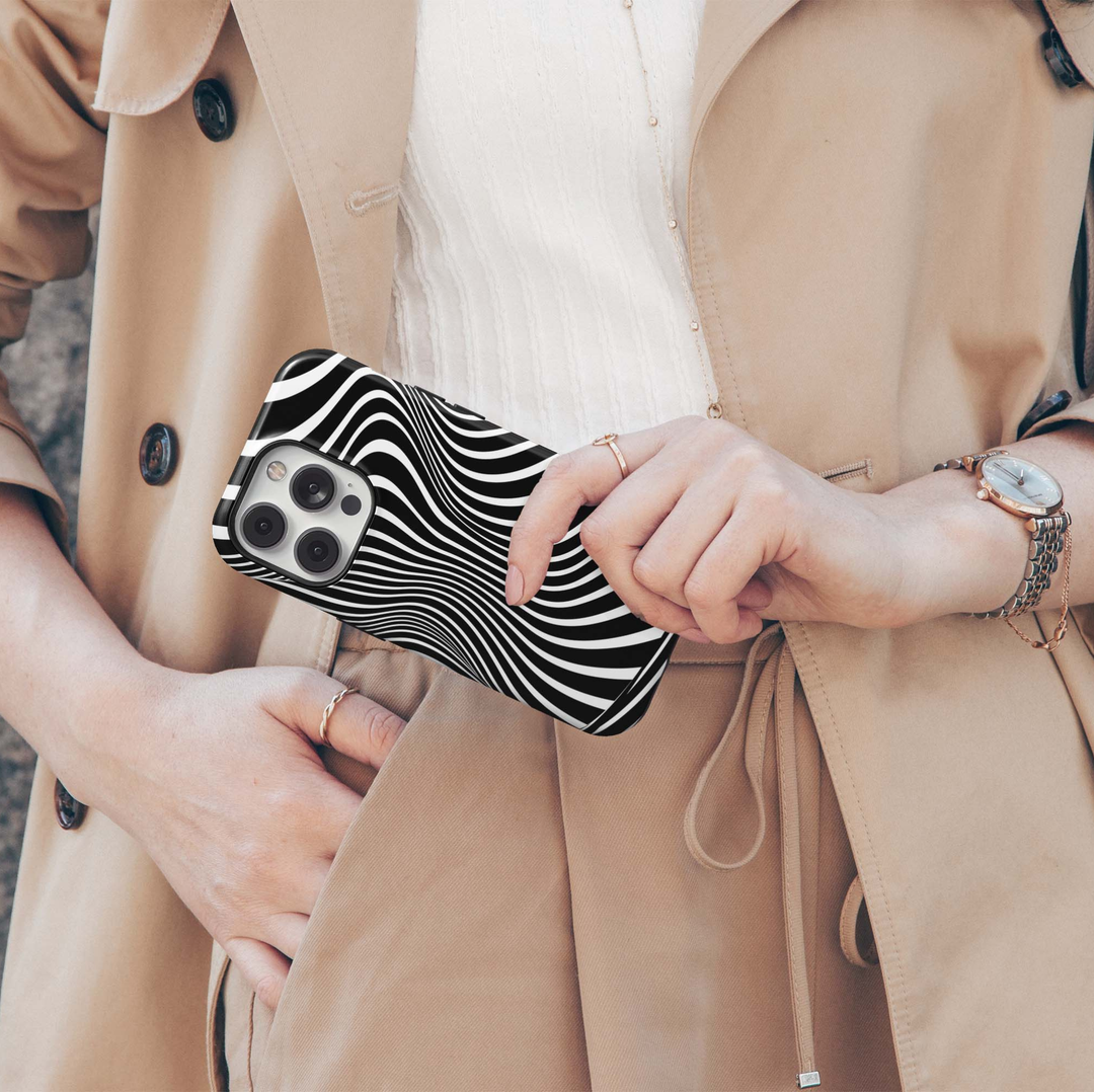 Optical Noir iPhone 18 Pro Max MagSafe case with high-contrast black and white flowing curved stripes creating a bold optical illusion pattern, a modern graphic tough iPhone 18 Pro phone case with MagSafe compatibility.