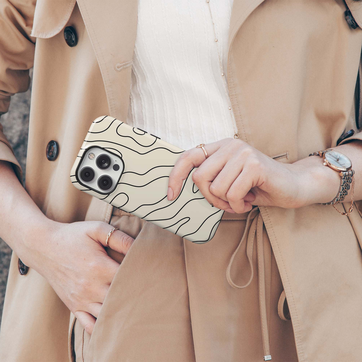 Contour Muse iPhone 18 Pro Max MagSafe case with flowing black abstract contour lines over a warm ivory cream background, a minimalist neutral tough iPhone 18 Pro phone case with modern organic line art and MagSafe compatibility.