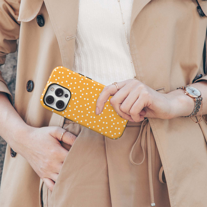 Golden Freckle orange polka dot iPhone 18 Pro Max MagSafe case with scattered white dots on a warm golden-orange background, a cute retro-inspired tough iPhone 18 Pro phone case with MagSafe compatibility.