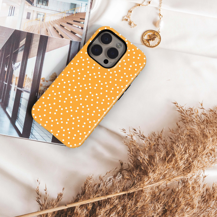 Golden Freckle orange polka dot iPhone 18 Pro Max MagSafe case with scattered white dots on a warm golden-orange background, a cute retro-inspired tough iPhone 18 Pro phone case with MagSafe compatibility.