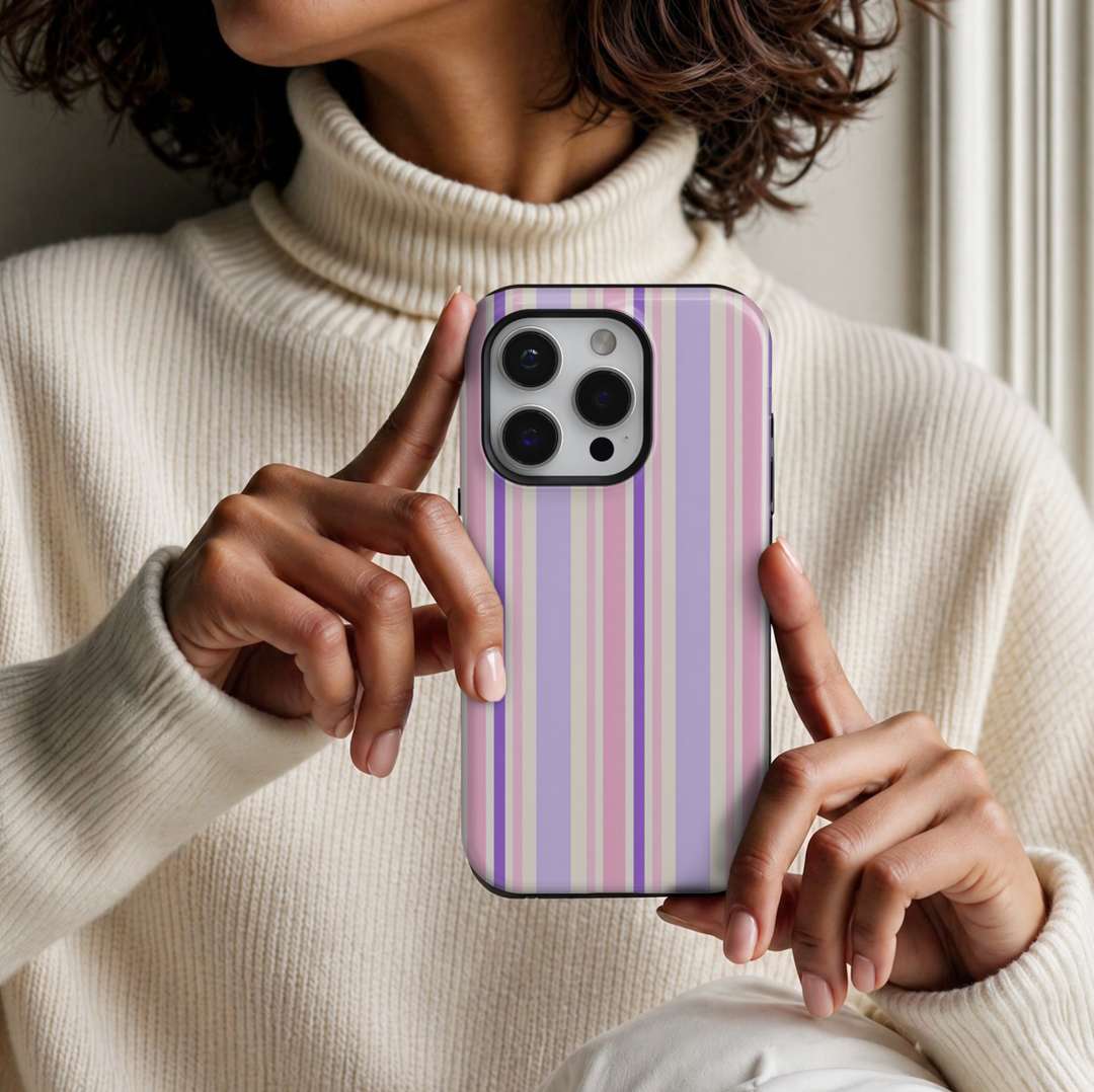 CASELIX Lavender Blush Stripe iPhone 18 Pro Max tough phone case featuring pastel lavender, baby pink, purple, and cream vertical stripes with a glossy printed finish. Cute preppy striped phone case for women with a soft coquette aesthetic.