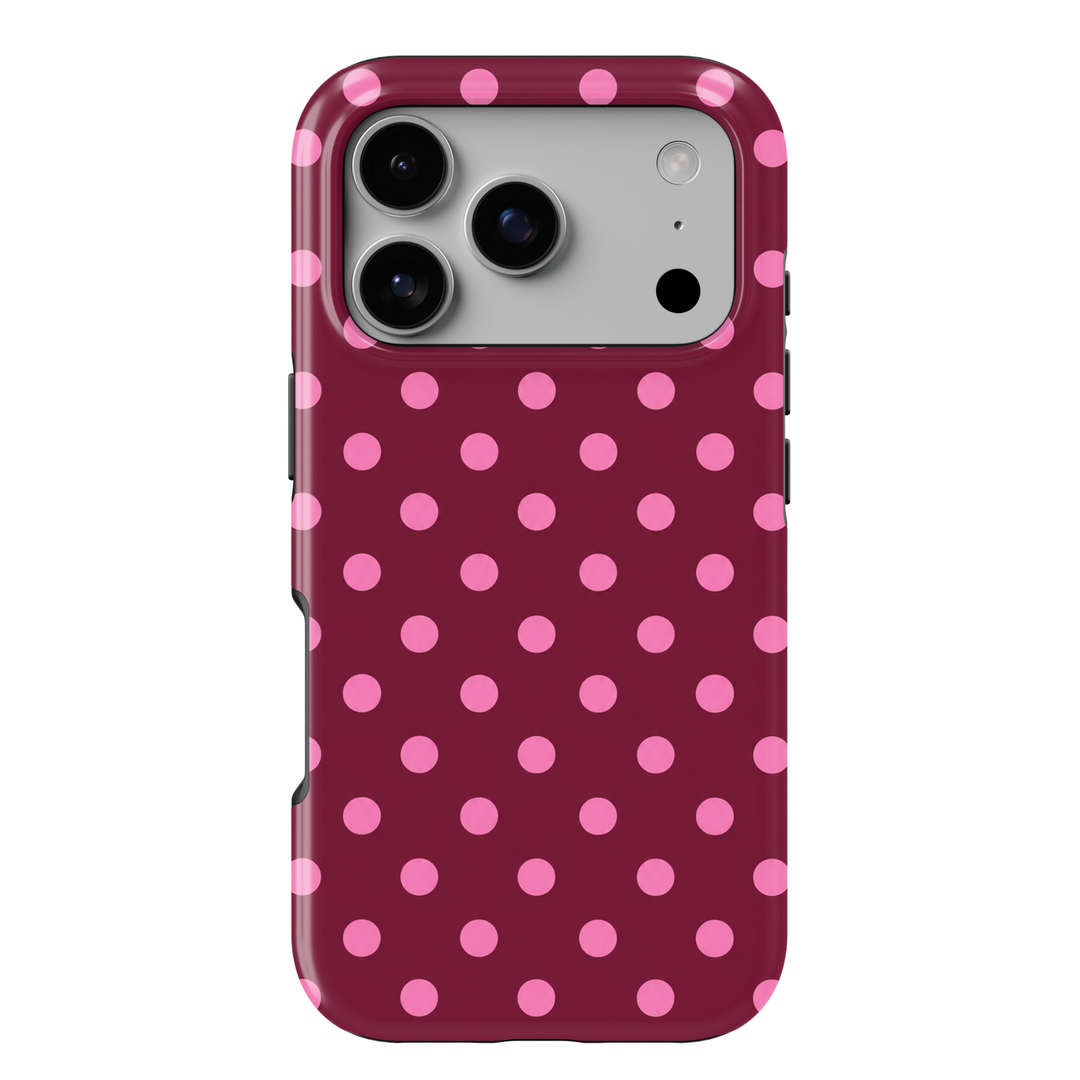 CASELIX Berry Blush Dots iPhone 18 Pro Max tough phone case featuring a deep raspberry burgundy background with bright pink polka dots in a repeating pattern. Trendy pink and burgundy polka dot phone case for women with a glossy printed finish and playful preppy aesthetic.