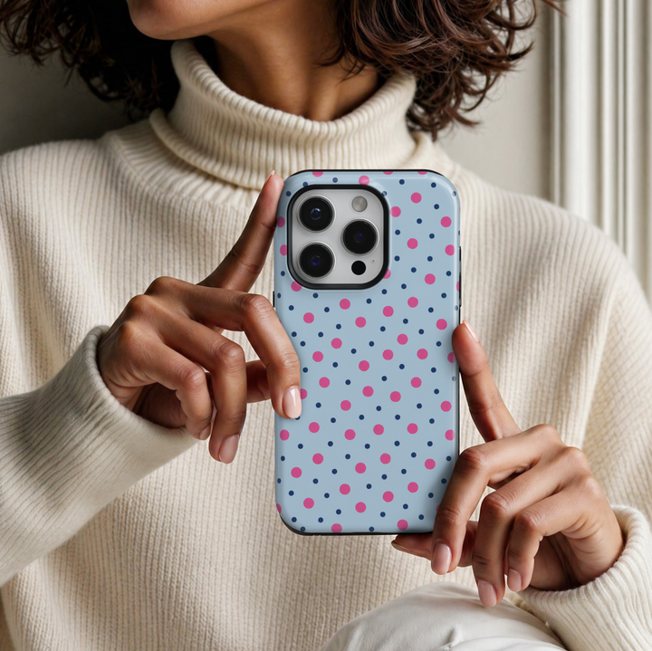 CASELIX Bubblegum Dots iPhone 18 Pro Max tough phone case featuring a pastel baby blue background with vibrant bubblegum pink and small navy blue polka dots. Cute preppy phone case for women with a glossy printed finish, colorful playful aesthetic, and protective design.