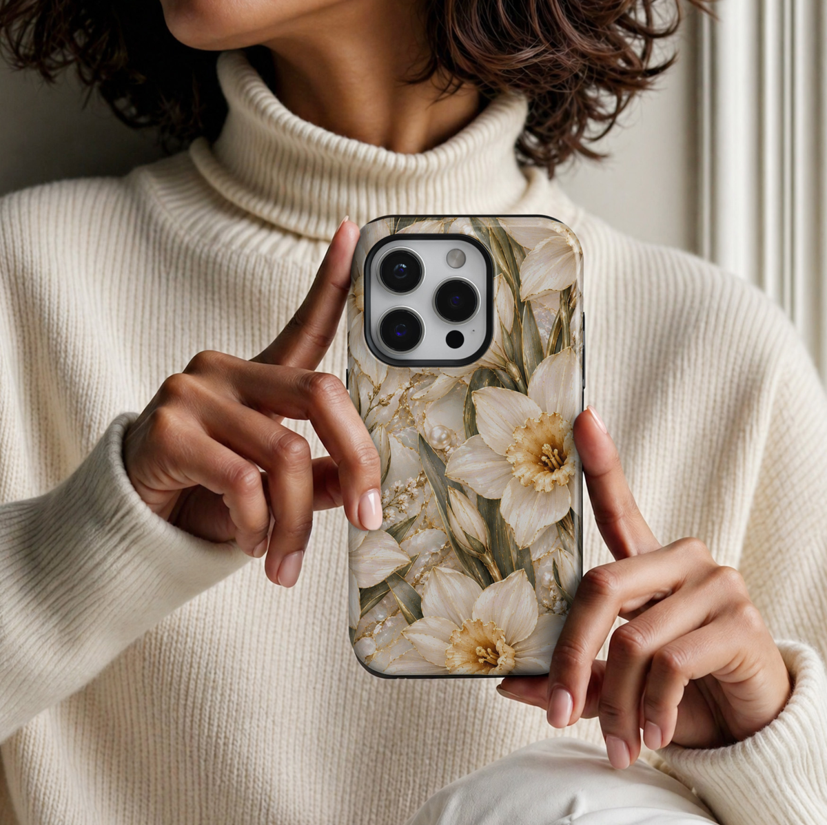 CASELIX December Birth Flower Narcissus Elegance iPhone 18 Pro Max tough phone case featuring elegant ivory-white narcissus flowers with champagne gold centers, delicate gold detailing, olive green leaves, pearl accents, and a luxurious cream marble-inspired background. A sophisticated white and gold floral phone case for women, perfect for December birthday gifts and timeless feminine styling.