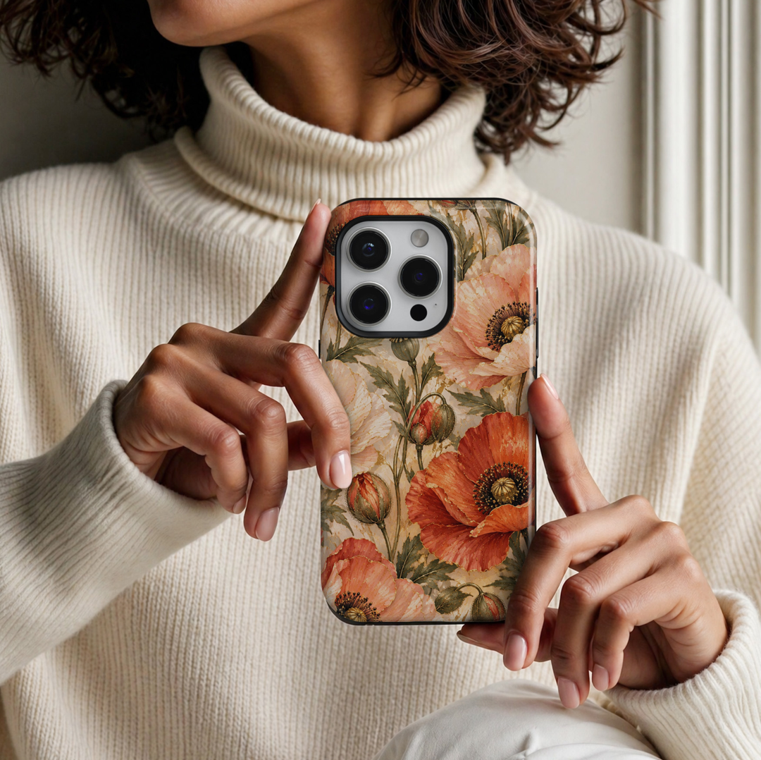 CASELIX August Birth Flower Poppy Radiance iPhone 18 Pro Max tough phone case featuring vibrant coral orange, peach and ivory poppy flowers with delicate gold accents, dark olive green leaves, and elegant floral buds against a luxurious cream marble-inspired background. A feminine botanical phone case with a warm romantic aesthetic, perfect for women who love elegant floral designs, sophisticated accessories, and meaningful August birthday gifts.