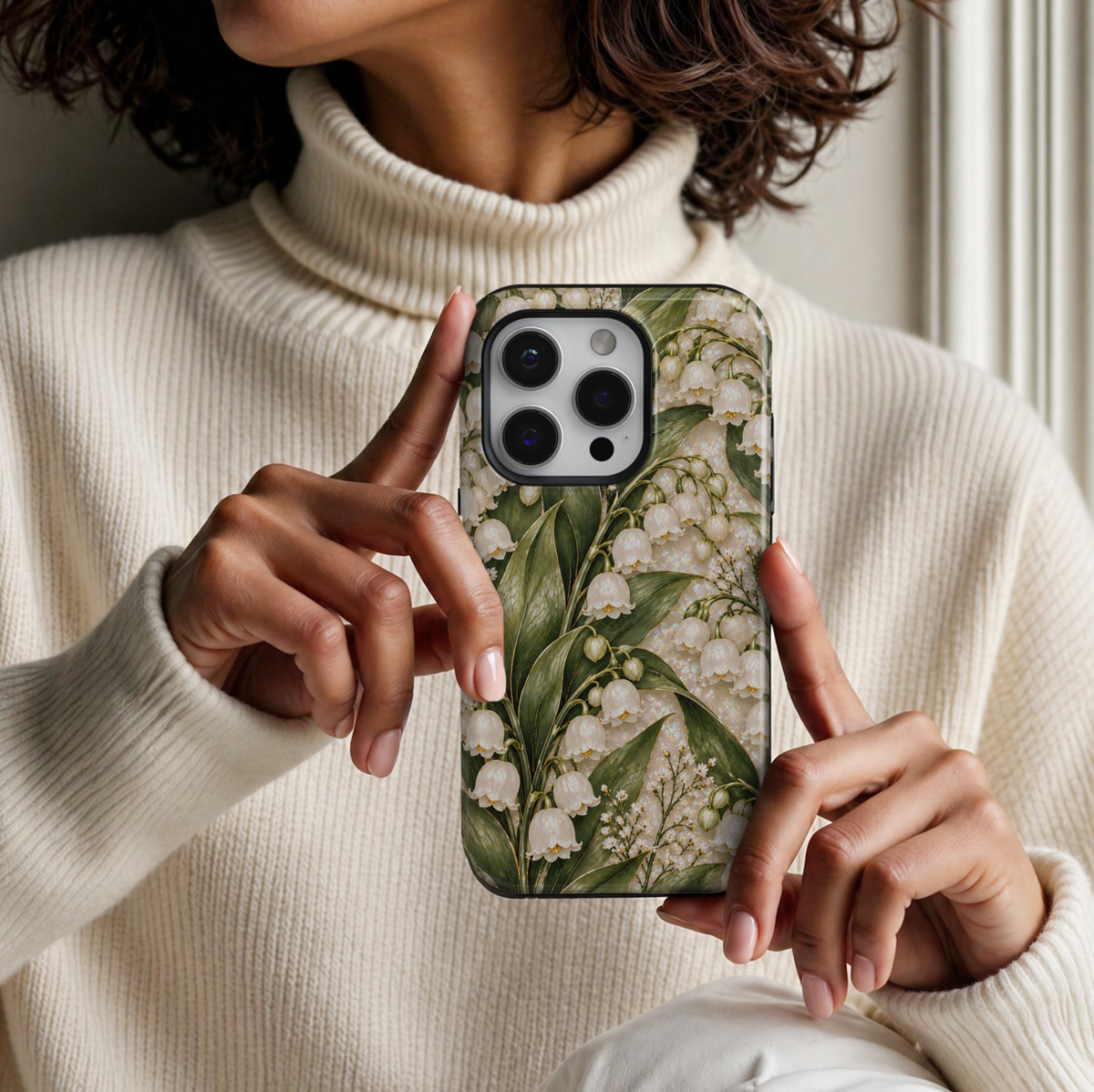 CASELIX May Birth Flower Lily of the Valley Grace iPhone 18 Pro Max tough phone case featuring delicate ivory-white bell-shaped lily of the valley flowers, elegant sage and deep green leaves, subtle golden accents, and a luminous pearlescent background. A romantic, feminine botanical phone case with a timeless luxury floral aesthetic, perfect for women who love cottagecore fashion, delicate spring flowers, and meaningful May birthday gifts.