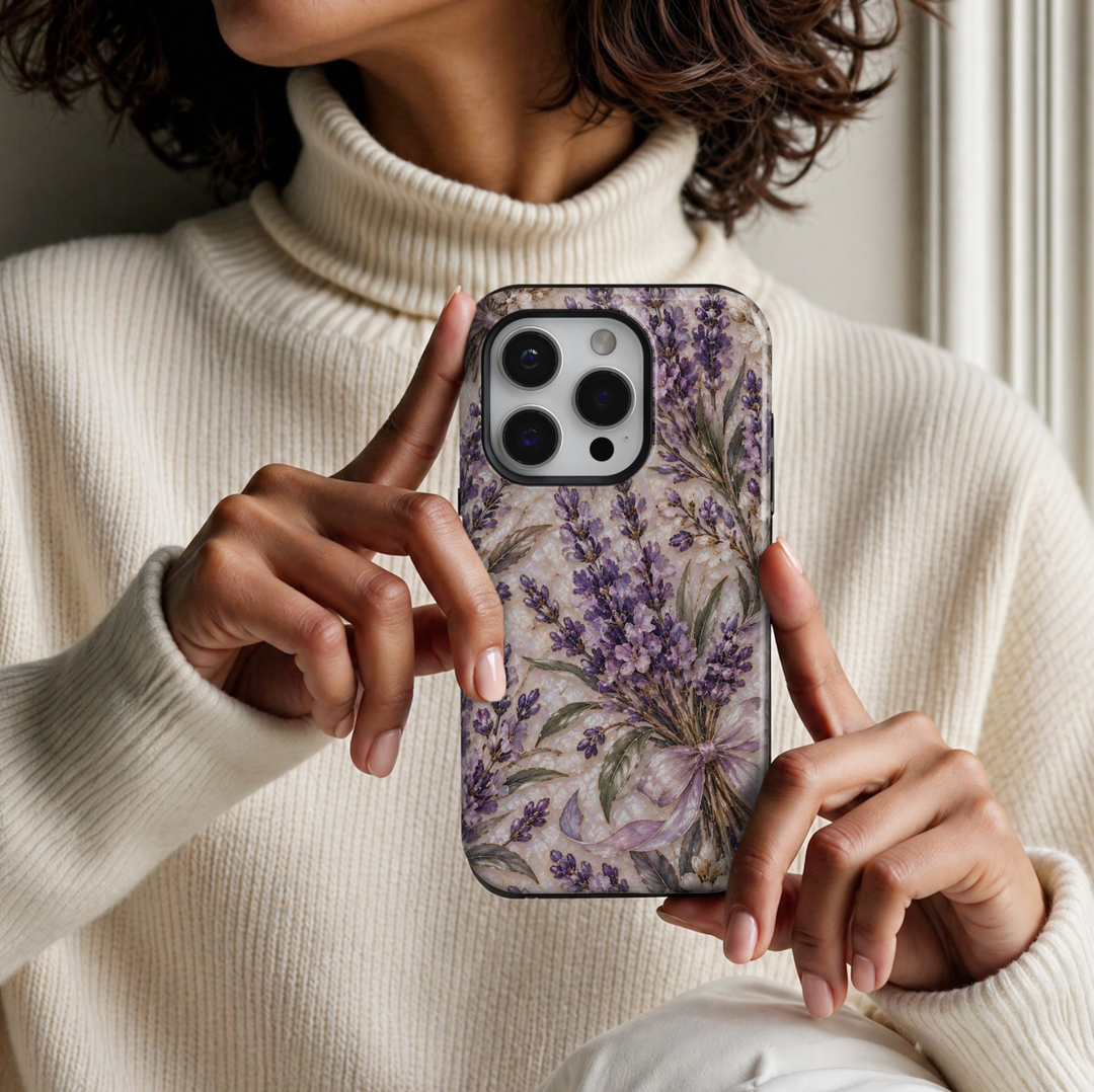 CASELIX March Birth Flower Lavender Serenity iPhone 18 Pro Max tough phone case featuring delicate lavender-purple blossoms tied with a soft lilac ribbon, sage green leaves, ivory flowers, elegant gold accents, and a luminous pearl-inspired background with a glossy printed finish.