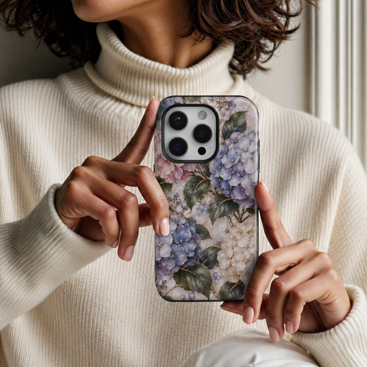 CASELIX February Birth Flower Hydrangea Heart iPhone 18 Pro Max tough case featuring delicate pastel blue, lavender, blush pink, and ivory hydrangea blossoms with elegant gold detailing, deep green botanical leaves, and a luminous pearl-inspired background with a glossy printed finish.