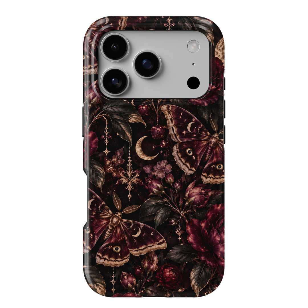 Midnight Moth iPhone 18 Pro Max tough phone case featuring elegant burgundy and bronze moths, deep wine-red roses, delicate floral buds, antique gold crescent moons, ornate celestial charms and dark botanical foliage against a dramatic black background with a glossy printed finish.
