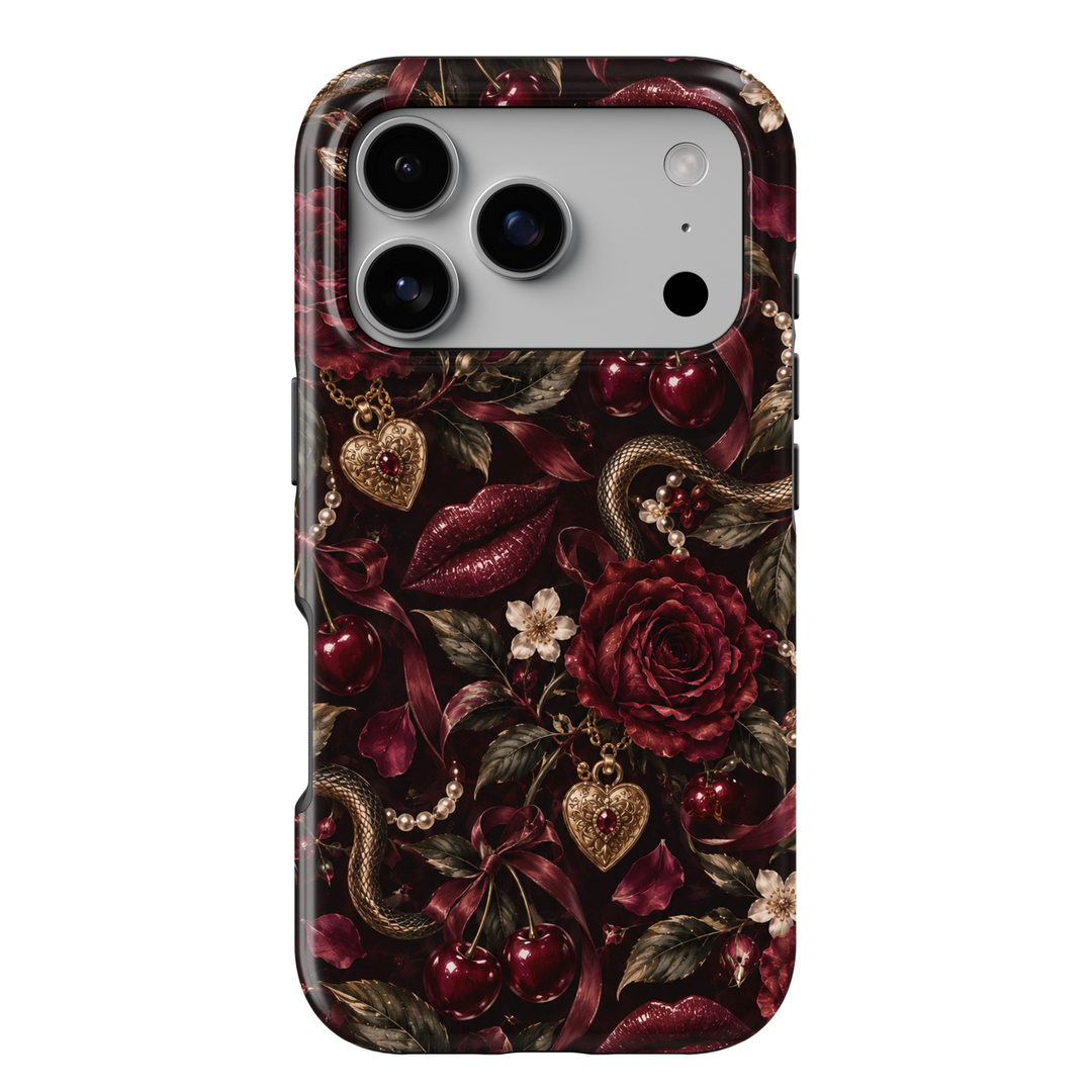 Forbidden Kiss iPhone 18 Pro Max tough phone case featuring deep burgundy roses, glossy cherry red lips, dark red cherries, antique gold snake details, vintage heart lockets, pearl strands and satin ribbons against a dramatic black background with a glossy printed finish.