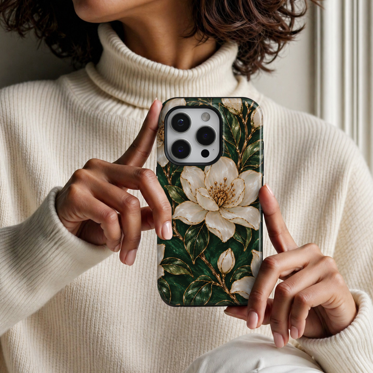 CASELIX Emerald Blossom iPhone 18 Pro Max case featuring elegant ivory white magnolia flowers with intricate gold outlines, golden floral centers, deep emerald green foliage and delicate botanical branches against a rich forest green background with a glossy printed finish.