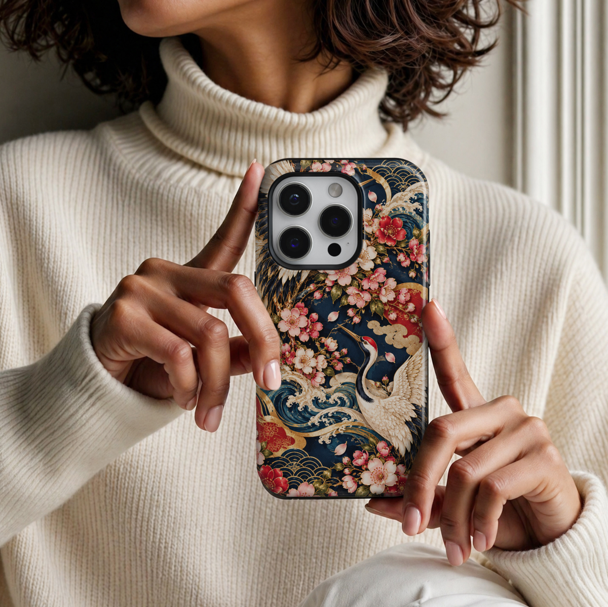 CASELIX Sakura Crane Elegance iPhone Tough MagSafe protective phone case featuring an exquisite Japanese-inspired design with graceful red-crowned cranes, delicate pink cherry blossoms, swirling ocean waves, and ornate golden accents against a rich midnight-navy background. The luxurious artwork showcases majestic Japanese cranes with elegantly outstretched ivory-white wings, intricate feather detailing, contrasting black plumage, and distinctive crimson-red crowns.

Beautiful clusters of blush-pink and cor