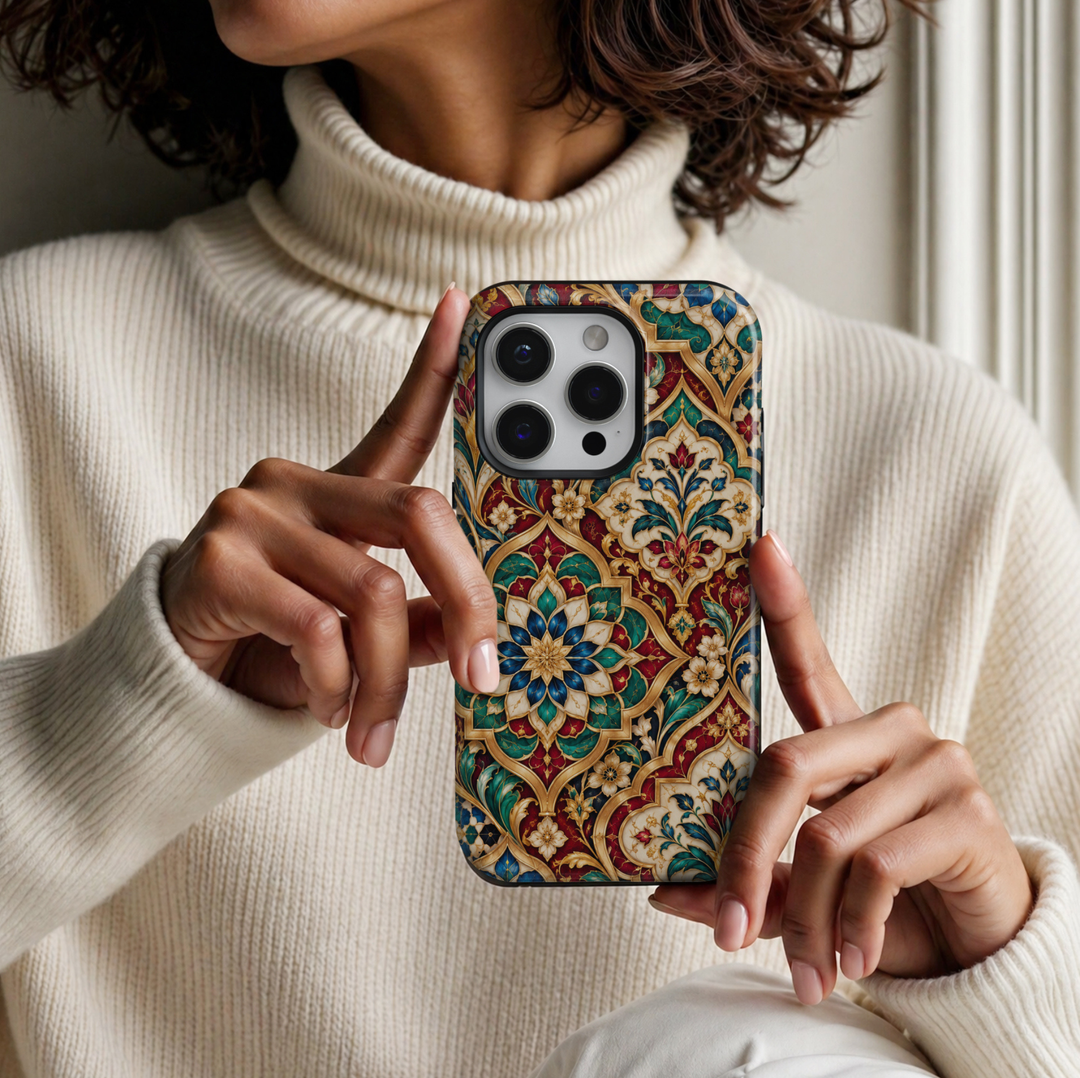CASELIX Royal Mughal Mosaic iPhone Tough MagSafe protective phone case featuring an exquisite Indian Mughal-inspired ornamental floral pattern with intricate stained-glass mosaic details in rich ruby red, emerald green, royal sapphire blue, ivory white, and champagne gold. The luxurious artwork showcases elaborate symmetrical floral medallions framed by elegant scalloped arches, inspired by the magnificent architecture and decorative artistry of historic Mughal palaces.