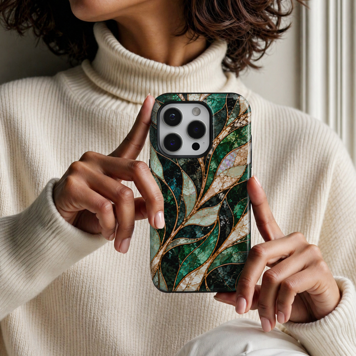 CASELIX Emerald Opal Waves iPhone Tough MagSafe protective phone case featuring a luxurious abstract stained-glass mosaic pattern with flowing, ribbon-like waves in rich emerald green, deep forest green, shimmering turquoise, champagne gold, and iridescent opal white. The elegant design showcases gracefully intertwined curved panels filled with intricate cracked-glass textures, luminous jade-green mosaic details, and shimmering pearl-inspired surfaces. Delicate metallic gold-inspired outlines separate each 
