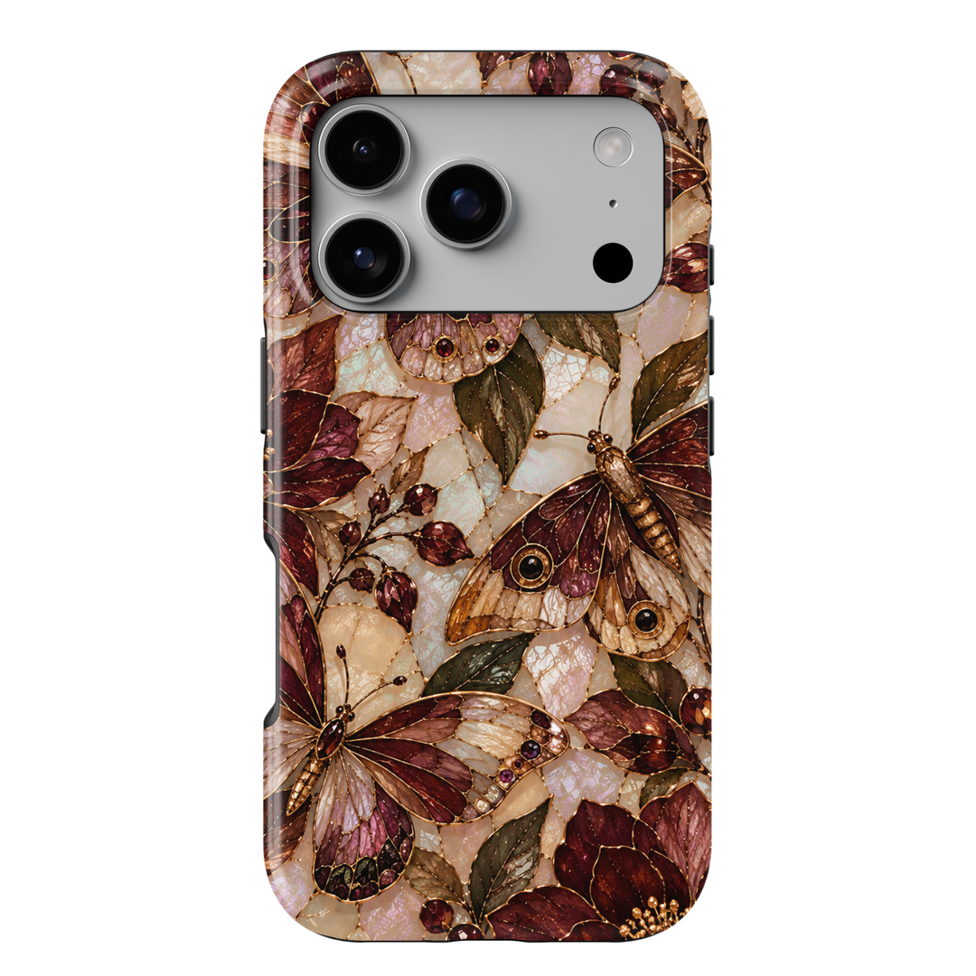 Cabernet Butterfly iPhone 18 Pro Max MagSafe case featuring stained-glass-inspired butterflies and moths in cabernet, burgundy, champagne and bronze with olive foliage and jewel-like berries over a pearlescent background, a luxurious tough iPhone 18 Pro butterfly phone case with MagSafe compatibility.