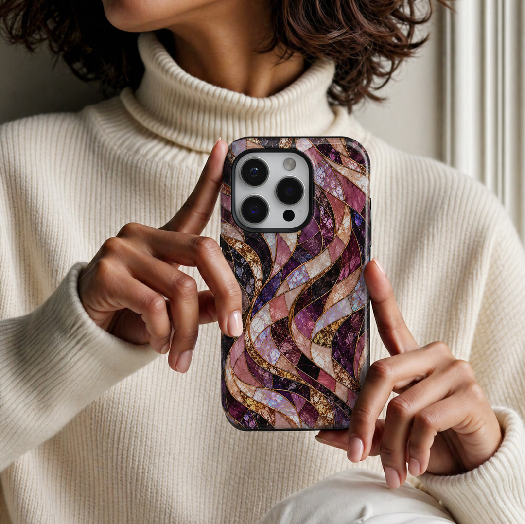 CASELIX Amethyst Opal Waves iPhone Tough MagSafe protective phone case featuring a luxurious abstract stained-glass mosaic pattern with flowing, ribbon-like waves in rich amethyst purple, deep plum, romantic blush pink, champagne gold, and iridescent opal white. The elegant design showcases gracefully intertwined curved panels filled with intricate cracked-glass textures, shimmering pearl-inspired surfaces, and luminous violet and rose-colored mosaic details. Delicate metallic gold-inspired outlines separat