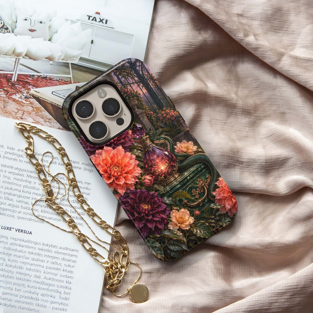Poison &amp; Petals Tough iPhone Case featuring an emerald green snake, ornate purple potion bottle and lush coral, burgundy, plum and blush flowers in a dark enchanted garden.