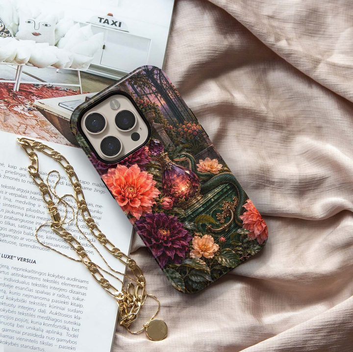Poison &amp; Petals Tough iPhone Case featuring an emerald green snake, ornate purple potion bottle and lush coral, burgundy, plum and blush flowers in a dark enchanted garden.