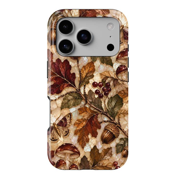 Enchanted Acorn iPhone 18 Pro Max MagSafe case featuring acorns, woodland mushrooms, moths, red berries and autumn leaves in chestnut, burgundy, amber and olive over a pearlescent stained-glass background, a whimsical tough iPhone 18 Pro fall phone case with MagSafe compatibility.