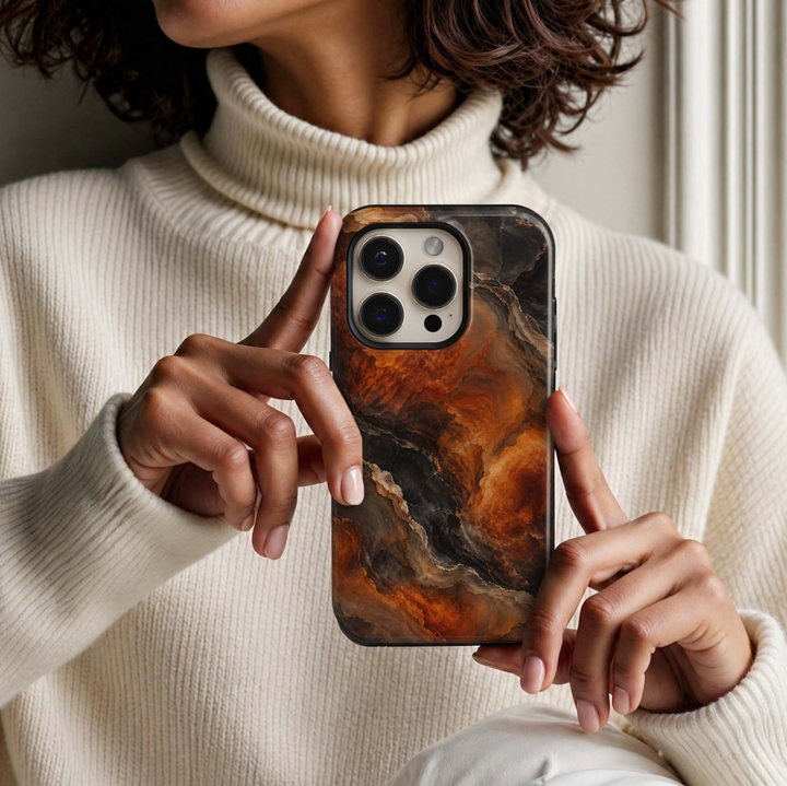 Ember Onyx Tough iPhone Case featuring molten burnt orange, amber and copper marble flowing through smoky black, espresso and taupe natural stone.