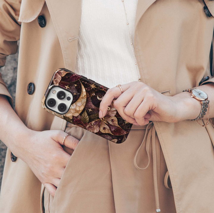 Midnight Moth iPhone 18 Pro Max MagSafe case featuring a jeweled celestial moth, crescent moons, stars and dark botanical details in burgundy, plum, champagne and antique gold, a luxurious stained-glass-inspired tough iPhone 18 Pro phone case with MagSafe compatibility.