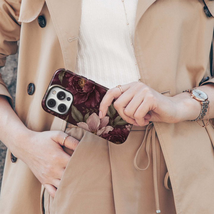 Merlot Garden iPhone 18 Pro Max MagSafe case featuring oversized merlot, burgundy and dusty blush flowers with muted olive foliage on a dark wine background, an elegant moody botanical tough iPhone 18 Pro floral phone case with MagSafe compatibility.