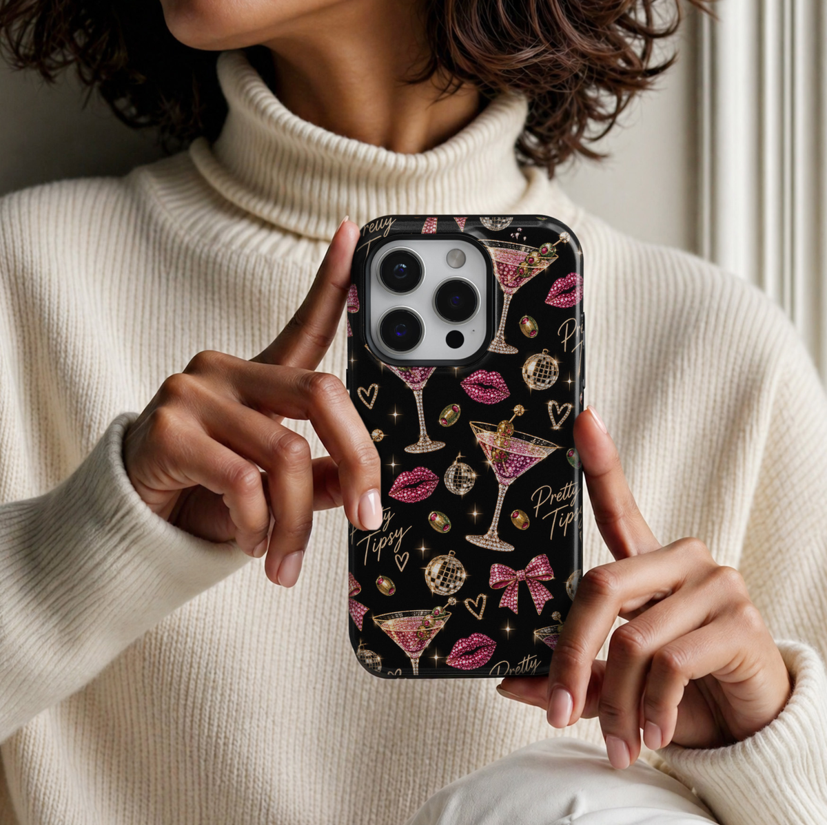 CASELIX Pretty Tipsy iPhone 18 Pro Max tough phone case featuring a glossy black background with sparkling pink dirty martini glasses, jeweled green olives, hot pink rhinestone lips, pink bows, gold disco balls, and Pretty Tipsy lettering. Trendy feminine printed phone case for women with a glamorous girls' night out, cocktail party, and bachelorette aesthetic.