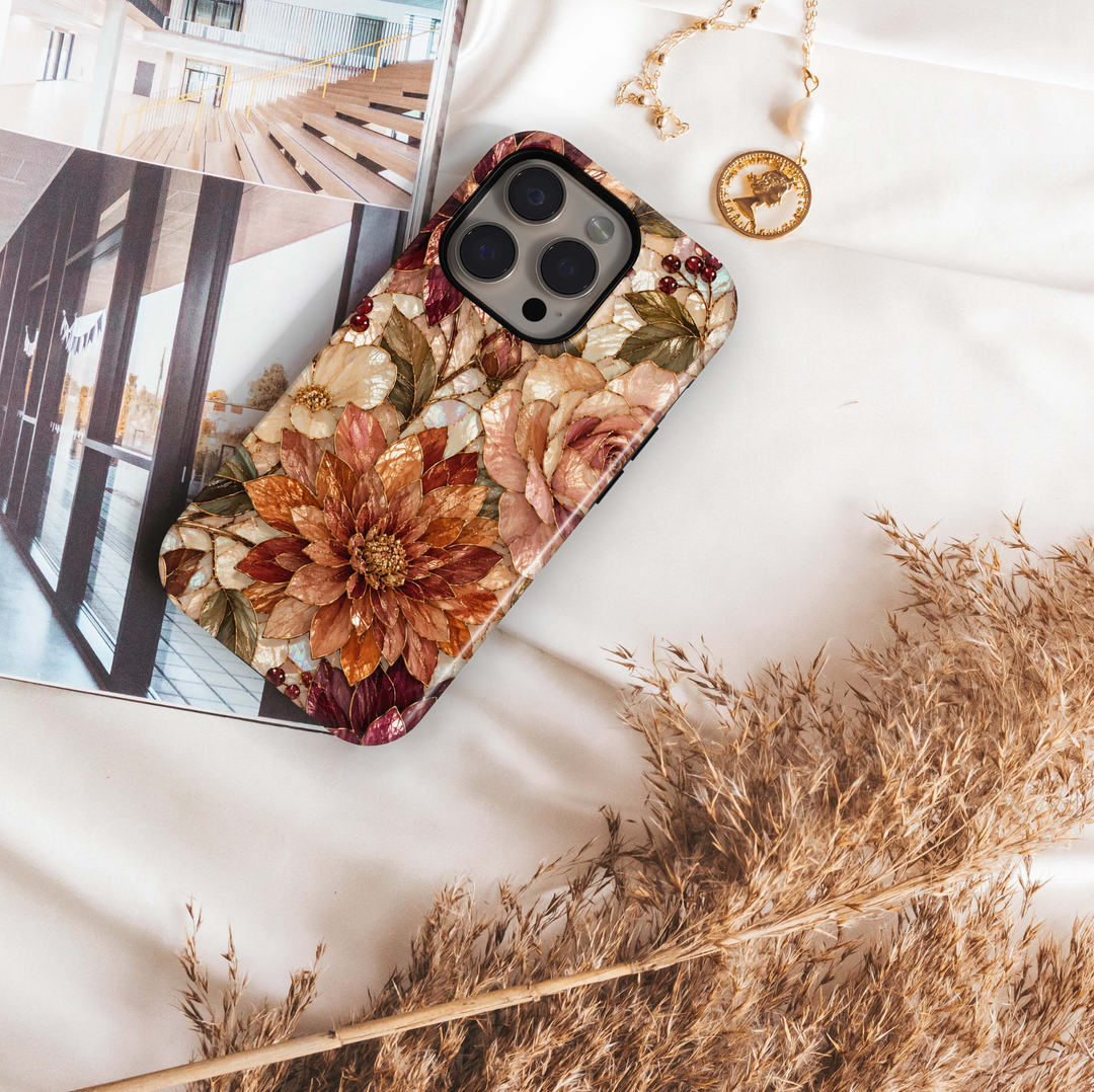Harvest Dahlia iPhone 18 Pro Max MagSafe case featuring stained-glass-inspired dahlias and roses in copper, caramel, champagne, burgundy, blush and ivory with antique gold detailing, a luxurious autumn floral tough iPhone 18 Pro phone case with MagSafe compatibility.