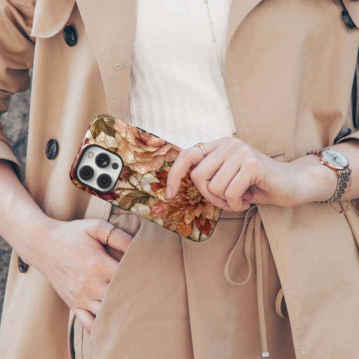 Harvest Dahlia iPhone 18 Pro Max MagSafe case featuring stained-glass-inspired dahlias and roses in copper, caramel, champagne, burgundy, blush and ivory with antique gold detailing, a luxurious autumn floral tough iPhone 18 Pro phone case with MagSafe compatibility.