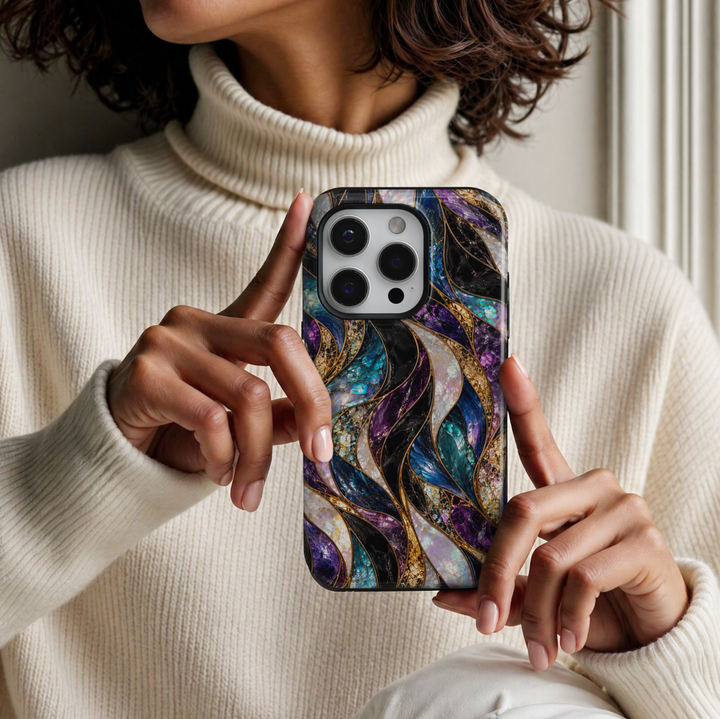 CASELIX Mystic Opal Waves iPhone Tough MagSafe protective phone case featuring a luxurious abstract stained-glass mosaic pattern with flowing, ribbon-like waves in rich amethyst purple, brilliant sapphire blue, luminous turquoise, midnight black, champagne gold, and iridescent opal white. The captivating design showcases gracefully intertwined curved panels filled with intricate cracked-glass textures, shimmering mother-of-pearl-inspired surfaces, and vibrant jewel-toned mosaic details. Delicate metallic go