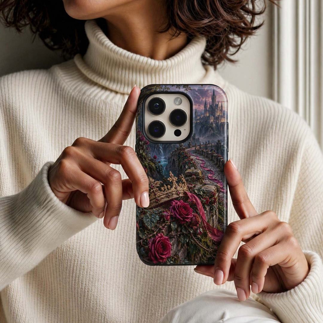 Briarbound Tough iPhone Case featuring a jeweled antique gold crown, deep crimson roses, winding vines and a dramatic stone bridge leading toward a fairytale castle.