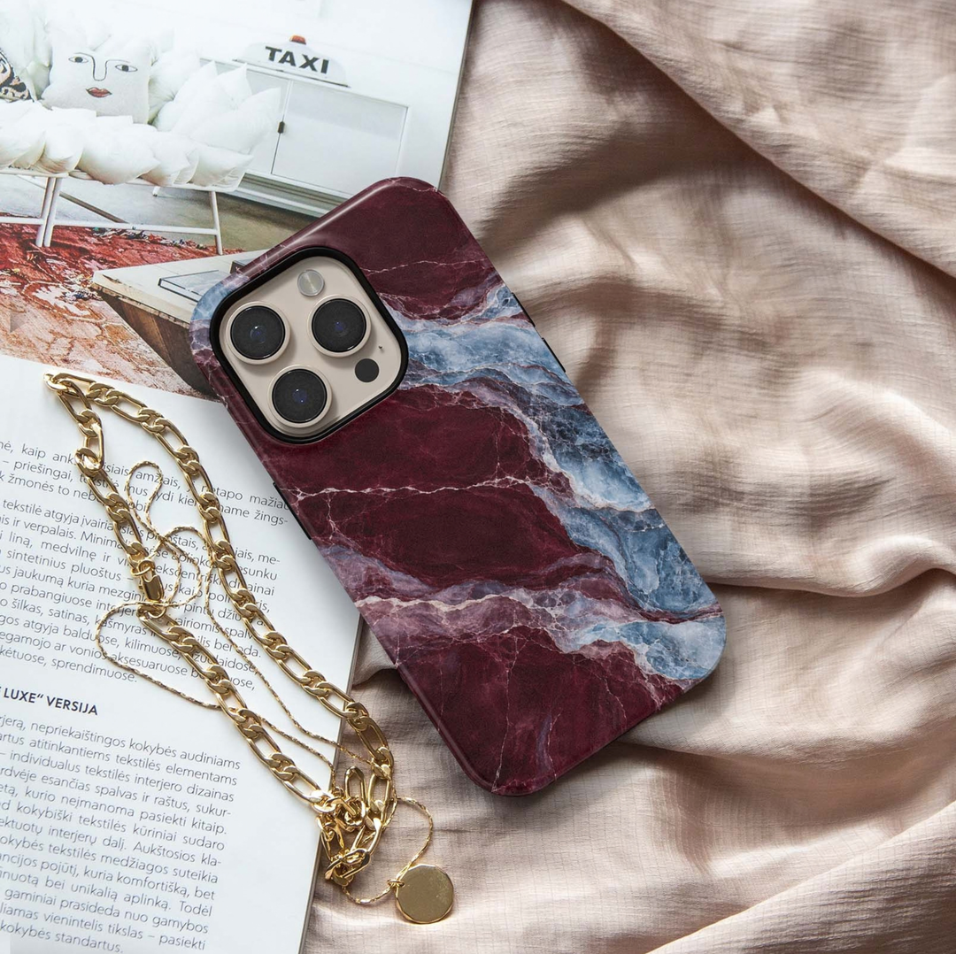 Cabernet Glacier Tough iPhone Case featuring deep cabernet burgundy marble blended with icy blue, slate and lavender crystalline stone veining.