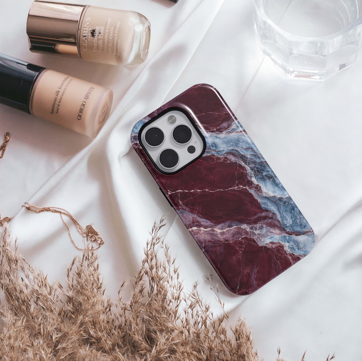 Cabernet Glacier Tough iPhone Case featuring deep cabernet burgundy marble blended with icy blue, slate and lavender crystalline stone veining.