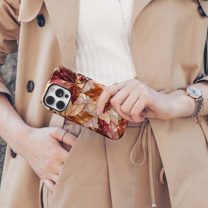 Autumn Opal iPhone 18 Pro Max MagSafe case featuring pearlescent autumn maple leaves in burgundy, copper, bronze, champagne and ivory with red berries and gold detailing, a luxurious stained-glass-inspired tough iPhone 18 Pro fall phone case with MagSafe compatibility.