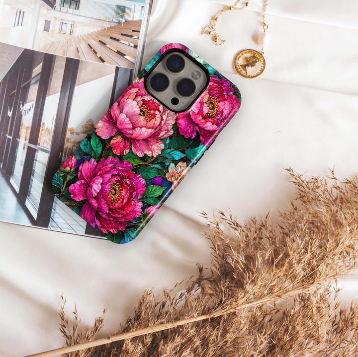 Jewel Peony iPhone 18 Pro Max MagSafe case featuring oversized fuchsia, hot pink and magenta peony flowers with emerald and teal foliage, a luxurious jewel-toned stained-glass-inspired tough iPhone 18 Pro floral phone case with MagSafe compatibility.