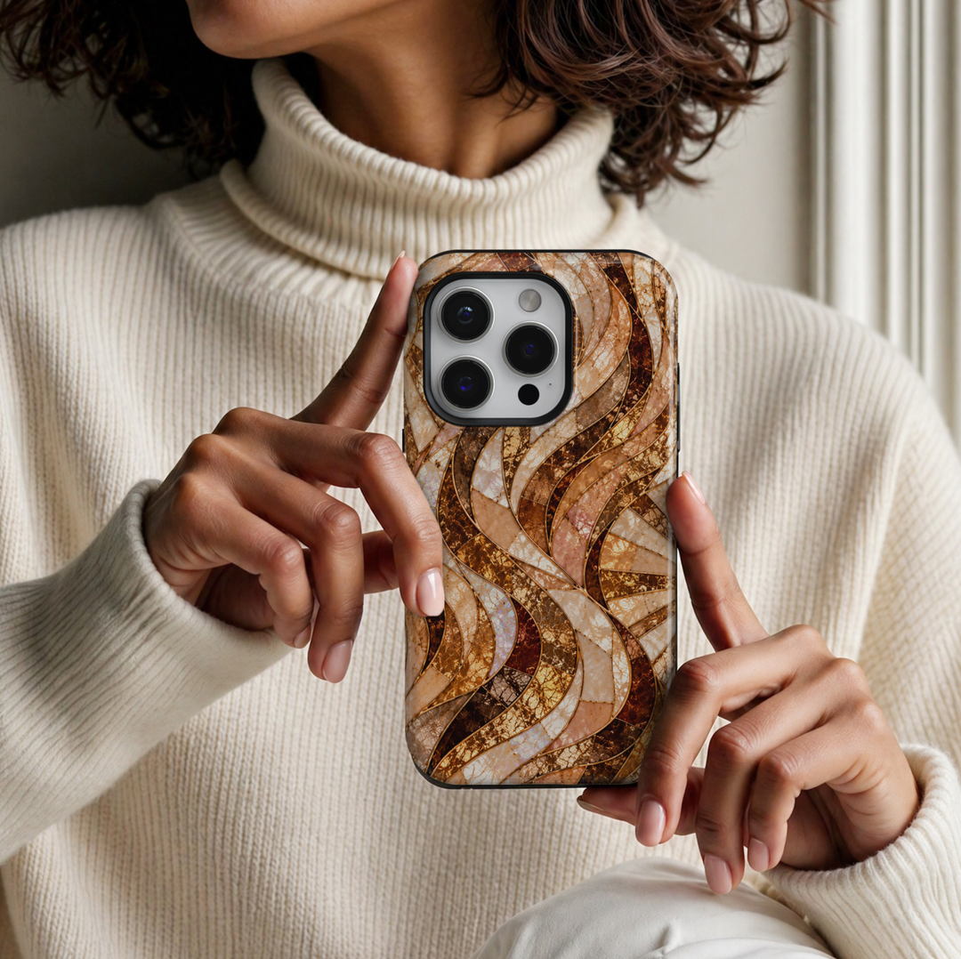 CASELIX Amber Opal Waves iPhone Tough MagSafe protective phone case featuring a luxurious abstract stained-glass mosaic pattern with flowing, ribbon-like waves in warm amber, champagne gold, caramel brown, creamy ivory, and iridescent opal. The elegant design showcases gracefully intertwined curved panels filled with intricate cracked-glass textures, shimmering pearl-inspired surfaces, and luminous honey-gold mosaic details. Delicate metallic gold-inspired outlines separate each flowing section, creating a 
